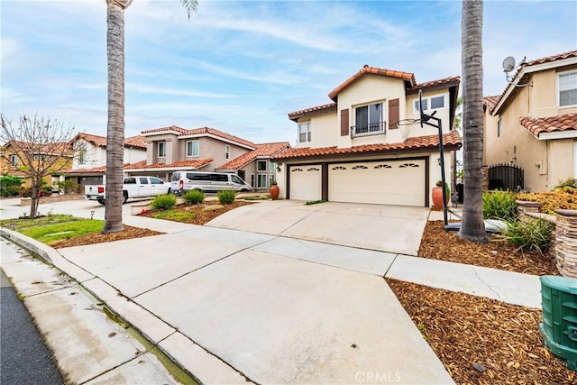 1081 Vista Lomas Ln, Corona, CA 92882 - mediterranean / spanish-style home featuring a balcony, driveway, cooling unit, a garage, and stucco siding
