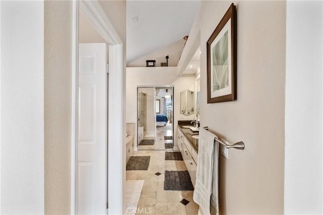 1081 Vista Lomas Ln, Corona, CA 92882 - hall with light tile patterned flooring, a sink, and vaulted ceiling