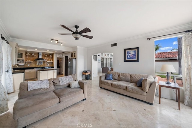1081 Vista Lomas Ln, Corona, CA 92882 - living room featuring ceiling fan, ornamental molding, arched walkways, and visible vents
