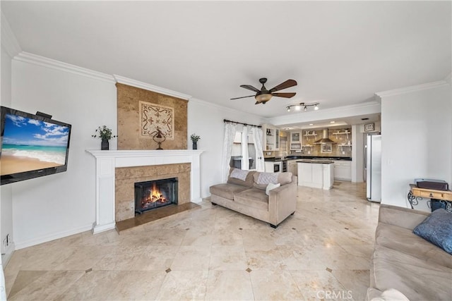 1081 Vista Lomas Ln, Corona, CA 92882 - living room featuring a ceiling fan, ornamental molding, a fireplace, and baseboards