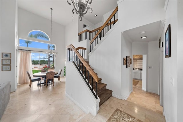1081 Vista Lomas Ln, Corona, CA 92882 - staircase featuring baseboards, an inviting chandelier, and a high ceiling