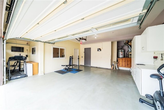 1081 Vista Lomas Ln, Corona, CA 92882 - garage with strapped water heater, a garage door opener, and washer / clothes dryer
