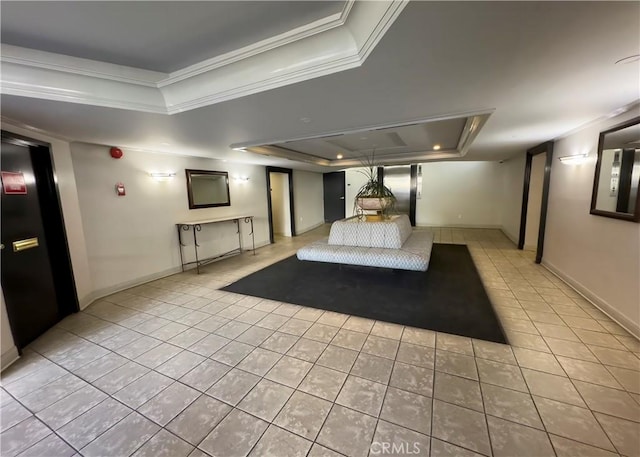 unfurnished bedroom with tile patterned flooring, ornamental molding, a raised ceiling, and baseboards