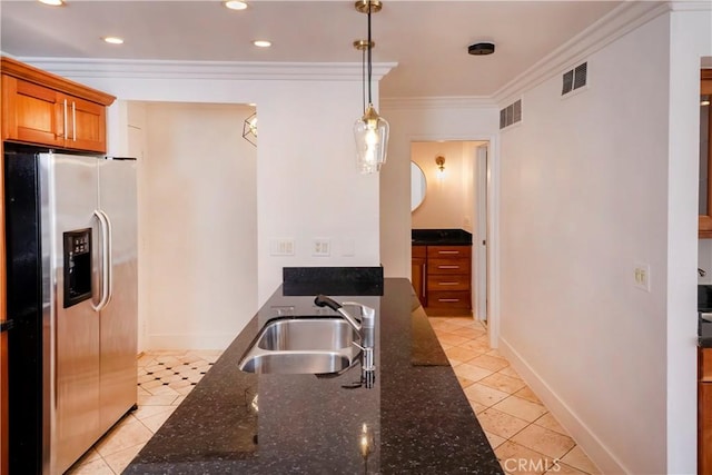 kitchen featuring crown molding, visible vents, stainless steel refrigerator with ice dispenser, a sink, and light tile patterned floors