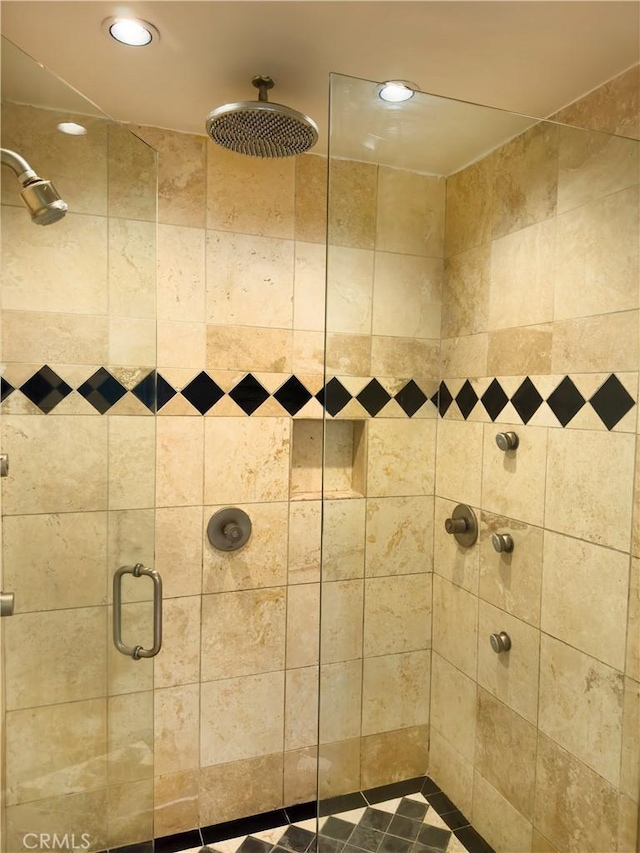 full bathroom with a stall shower and recessed lighting