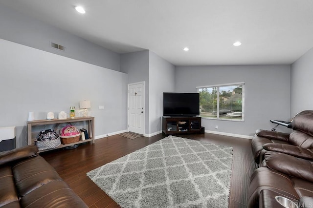 living area with baseboards, recessed lighting, wood finished floors, and visible vents