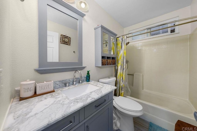 full bath with vanity, shower / bath combination with curtain, and toilet