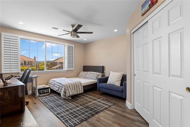 bedroom with ceiling fan, a closet, recessed lighting, and wood finished floors