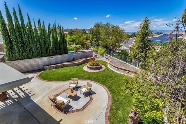 view of yard with fence and a patio area