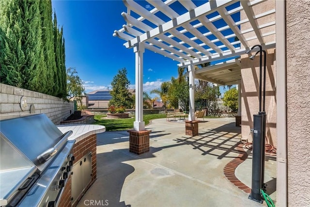 view of patio featuring fence, a pergola, and area for grilling