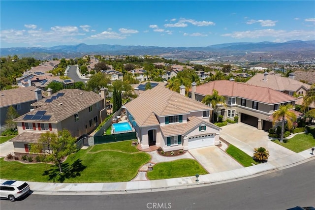 drone / aerial view with a residential view and a mountain view