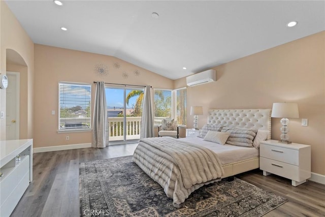 bedroom featuring access to exterior, a wall mounted AC, wood finished floors, baseboards, and lofted ceiling