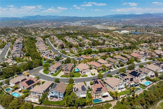 birds eye view of property with a residential view and a mountain view