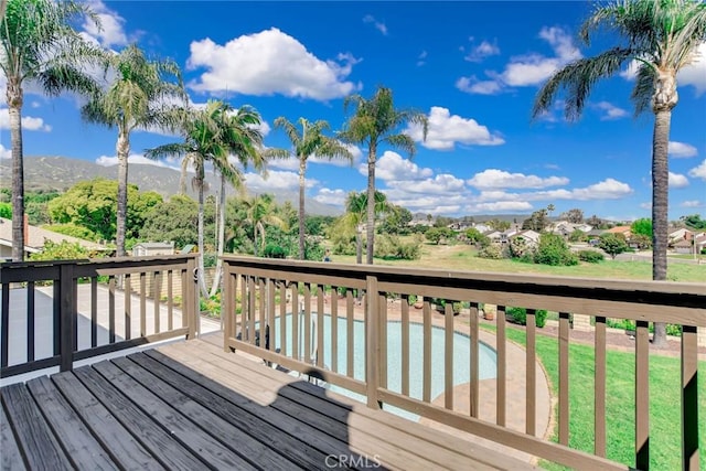 wooden deck with a mountain view