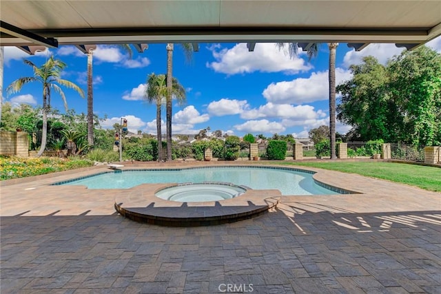 view of pool with a fenced in pool, an in ground hot tub, fence, and a patio