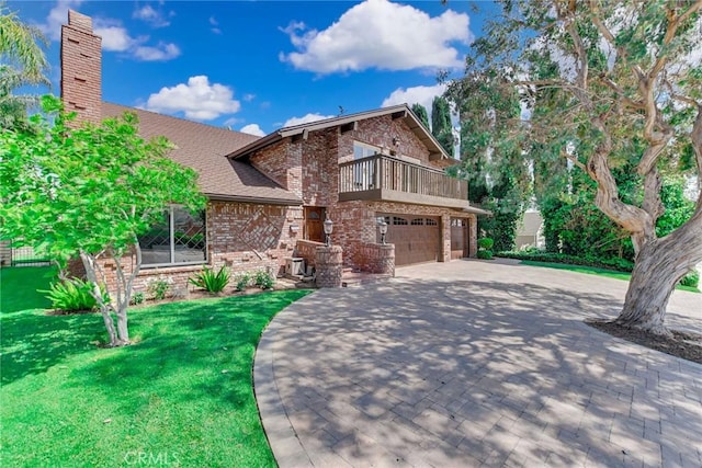 view of front of home with driveway, a front yard, brick siding, a balcony, and an attached garage