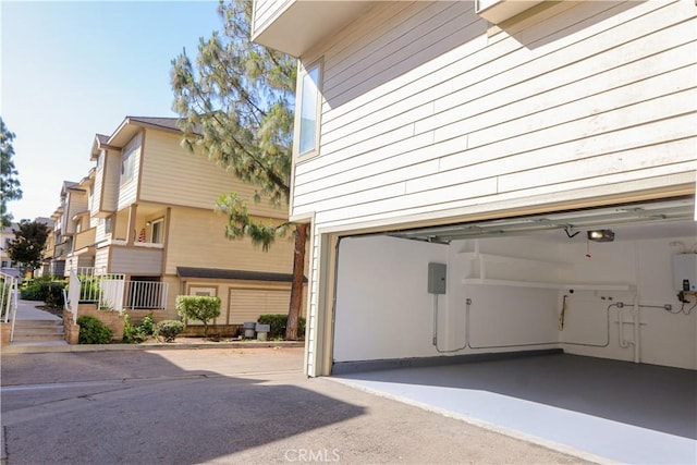 exterior space with a garage door opener