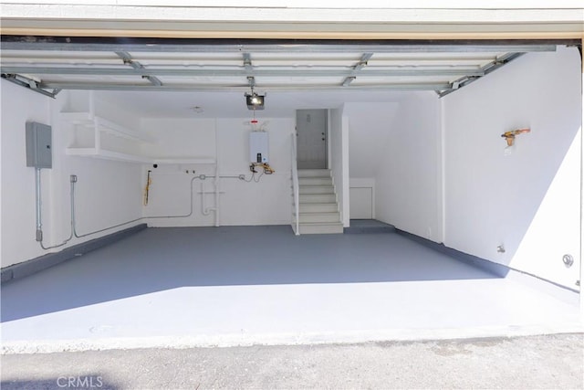 11150 Glenoaks Blvd Unit 256, Pacoima, CA 91331 - garage featuring water heater, a garage door opener, and electric panel
