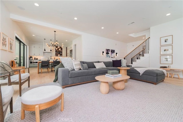 13 Goldenrod, Lake Forest, CA 92630 - living area with light wood-style flooring, a chandelier, stairs, and recessed lighting