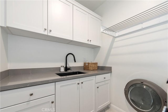 13 Goldenrod, Lake Forest, CA 92630 - laundry area with cabinet space and baseboards
