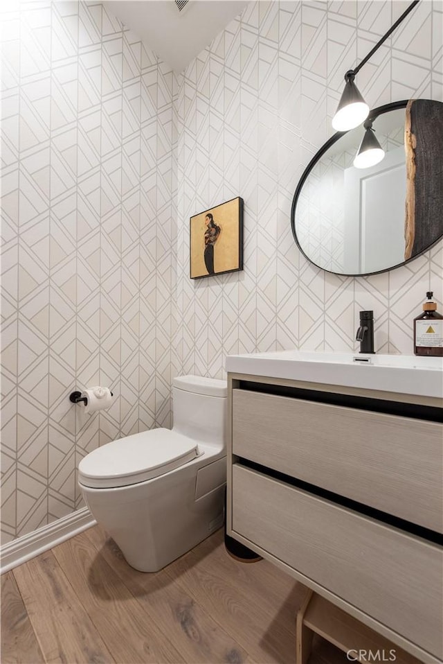 13 Goldenrod, Lake Forest, CA 92630 - bathroom featuring toilet, wood finished floors, and vanity