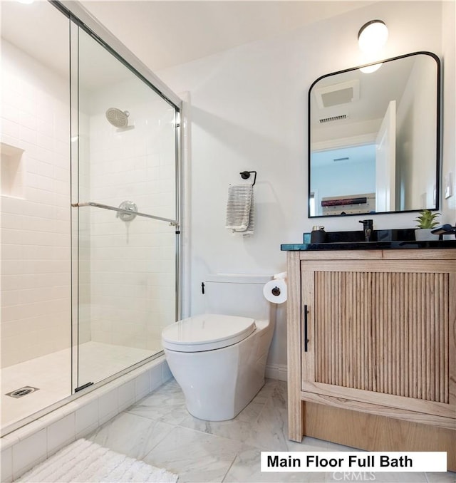 13 Goldenrod, Lake Forest, CA 92630 - bathroom featuring a stall shower, marble finish floors, toilet, and vanity