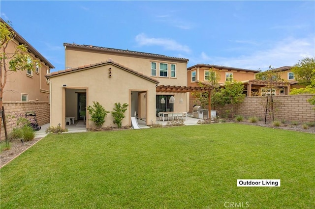 13 Goldenrod, Lake Forest, CA 92630 - back of property with a pergola, a patio, stucco siding, and a tiled roof