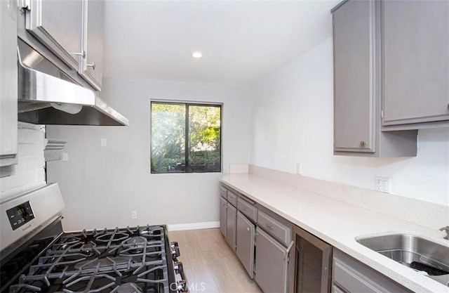 8641 Glenoaks Blvd Unit 107, Sun Valley, CA 91352 - kitchen with light countertops, gray cabinets, and gas range