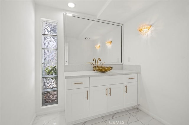 4250 Louise Ave, Encino, CA 91316 - bathroom with baseboards, marble finish floor, and vanity