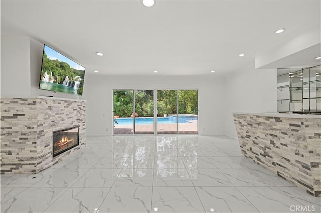 4250 Louise Ave, Encino, CA 91316 - unfurnished living room with a tiled fireplace, recessed lighting, and marble finish floor