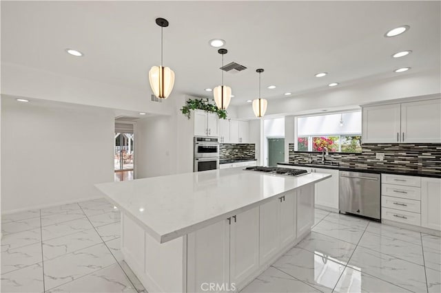 4250 Louise Ave, Encino, CA 91316 - kitchen with recessed lighting, appliances with stainless steel finishes, a healthy amount of sunlight, and marble finish floor