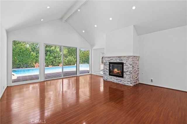 4250 Louise Ave, Encino, CA 91316 - unfurnished living room featuring wood finished floors, beam ceiling, a healthy amount of sunlight, and high vaulted ceiling