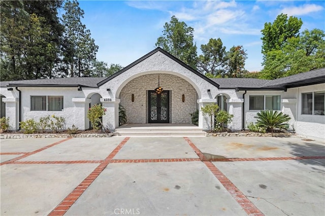 4250 Louise Ave, Encino, CA 91316 - view of front of property with french doors and stone siding