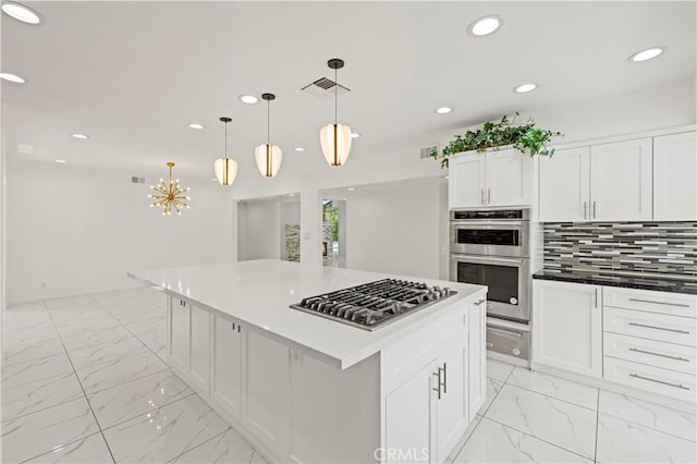 4250 Louise Ave, Encino, CA 91316 - kitchen with visible vents, appliances with stainless steel finishes, white cabinets, marble finish floor, and recessed lighting