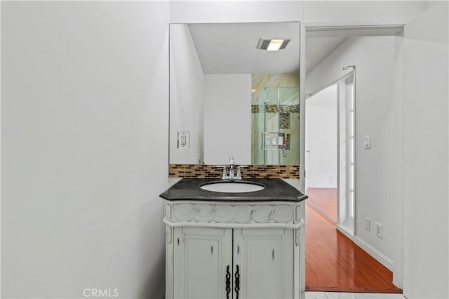 4250 Louise Ave, Encino, CA 91316 - bathroom with vanity, decorative backsplash, wood finished floors, and visible vents