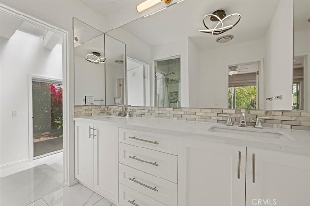 4250 Louise Ave, Encino, CA 91316 - full bath with a sink, double vanity, marble finish floor, a shower stall, and tasteful backsplash
