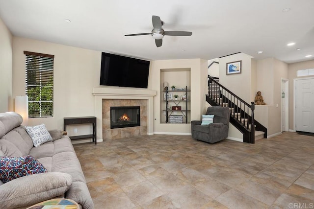 750 Arbor Glen Ln, Vista, CA 92081 - living room featuring baseboards, ceiling fan, stairway, and a tile fireplace