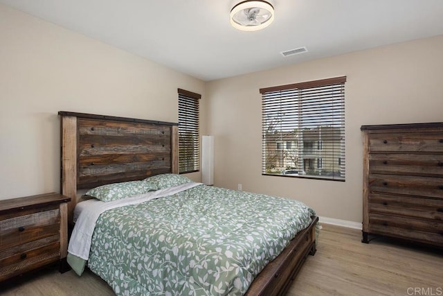 750 Arbor Glen Ln, Vista, CA 92081 - bedroom with baseboards, visible vents, and wood finished floors