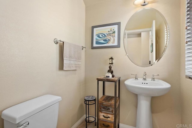 750 Arbor Glen Ln, Vista, CA 92081 - bathroom with a sink, baseboards, and toilet