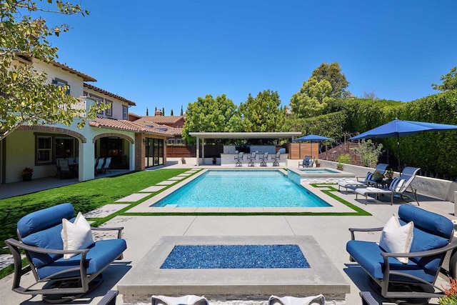 6981 Corte Langosta, Carlsbad, CA 92009 - view of pool featuring a patio, an outdoor fire pit, a fenced backyard, exterior bar, and a pool with connected hot tub