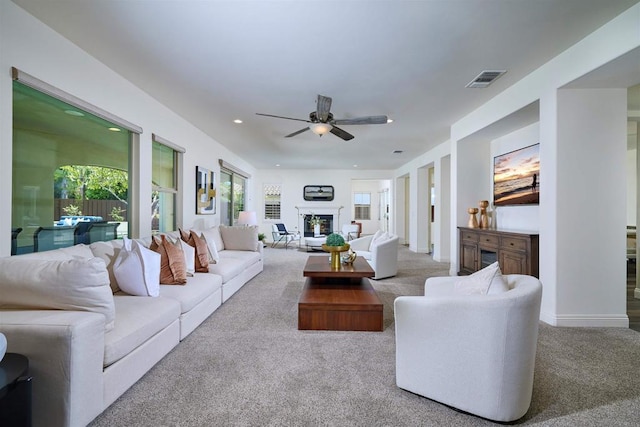 6981 Corte Langosta, Carlsbad, CA 92009 - living area with a fireplace, carpet floors, a ceiling fan, and recessed lighting
