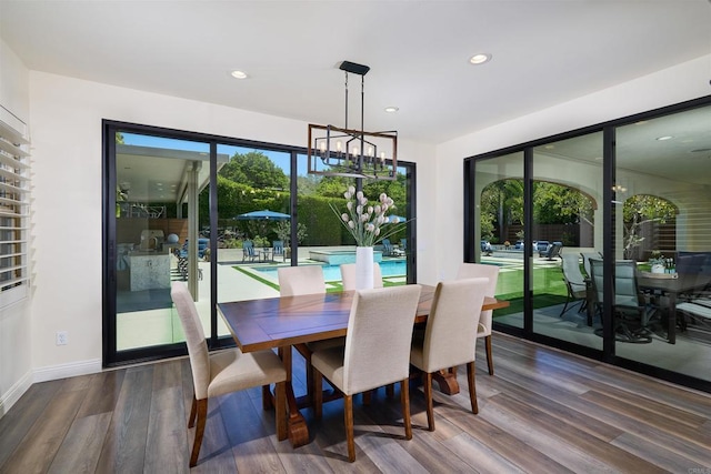 6981 Corte Langosta, Carlsbad, CA 92009 - dining area featuring a chandelier, wood finished floors, recessed lighting, and baseboards