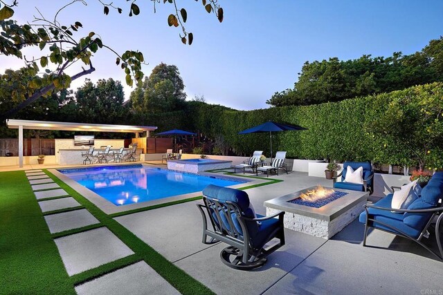 6981 Corte Langosta, Carlsbad, CA 92009 - view of swimming pool featuring an in-ground hot tub, a patio area, and an outdoor living space with a fire pit