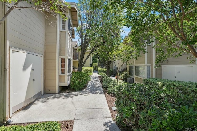 view of property exterior featuring central AC and a patio area