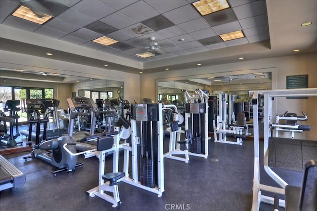 gym with a drop ceiling and a raised ceiling