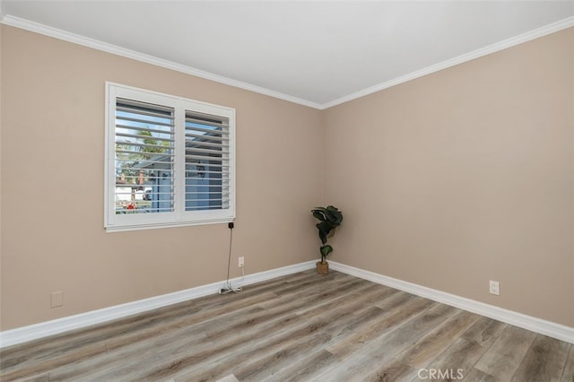 18401 Goodwin Ln, Huntington Beach, CA 92646 - empty room with crown molding, baseboards, and light wood-style floors
