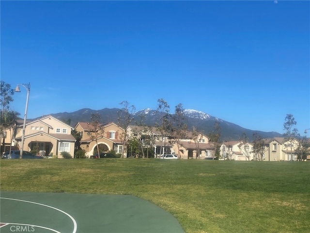 view of mountain backdrop featuring nearby suburban area