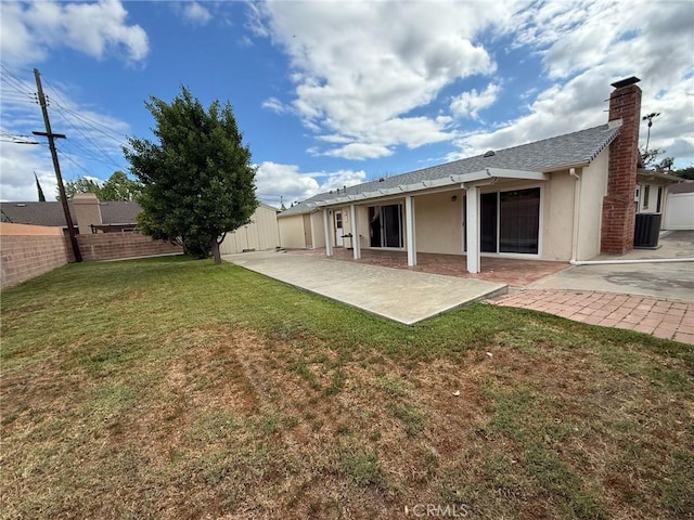 7940 Lena Ave, West Hills, CA 91304 - back of property featuring fence, stucco siding, a chimney, a patio area, and a lawn