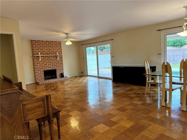 7940 Lena Ave, West Hills, CA 91304 - living area featuring a ceiling fan, a healthy amount of sunlight, and a fireplace
