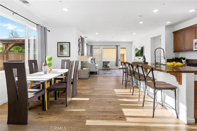 6410 Eucalyptus Ave, Chino, CA 91710 - dining space with recessed lighting, light wood finished floors, and visible vents